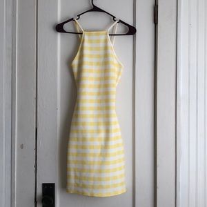 Bright yellow mini dress with cutoff back design